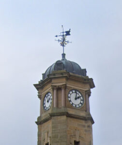 Mercer Clock Tower showing the mortar and pestle.