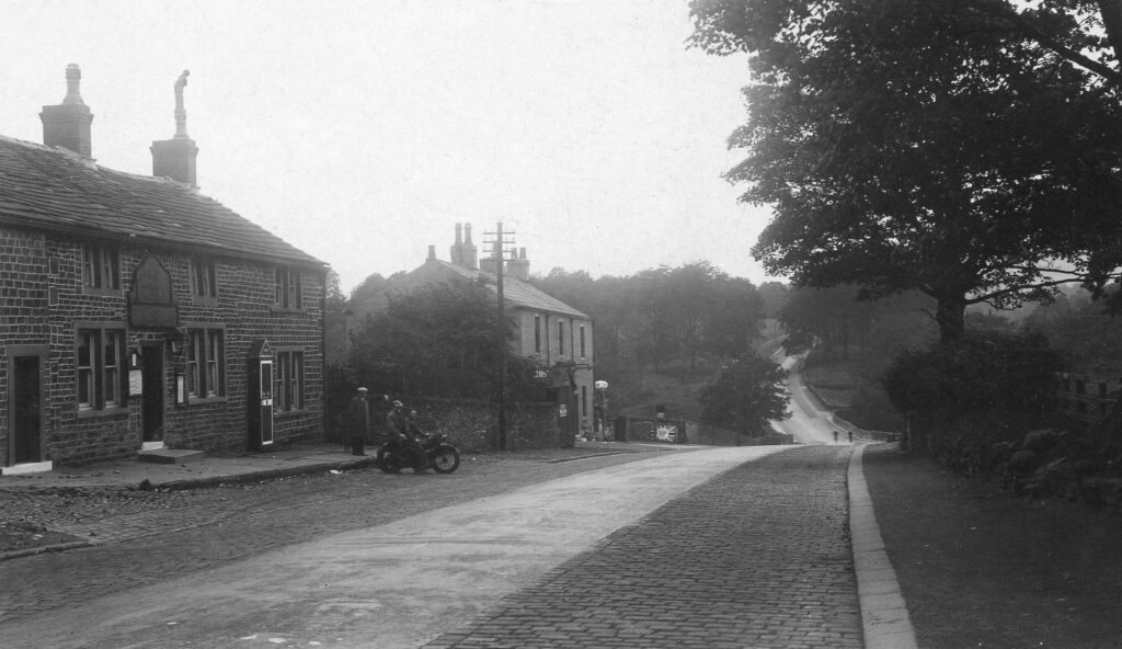 Cock Bridge Inn and cottages with motorbikers mid 20th century